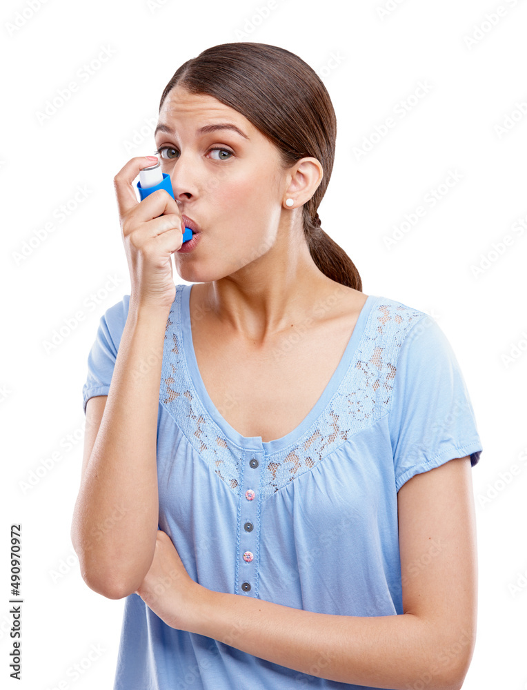 Take a deep breath. Studio portrait of an attractive young woman using an asthma inhaler. Take a deep breath. Studio portrait of an attractive young woman using an asthma inhaler.