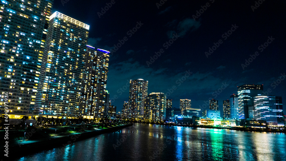 Night view of a high-rise condominium along an urban river_33