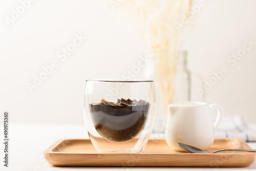 Grass jelly dessert with milk on white background, Traditional sweets that are cultural heritage of Asia.