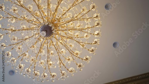 Looking straight up at chandelier photo