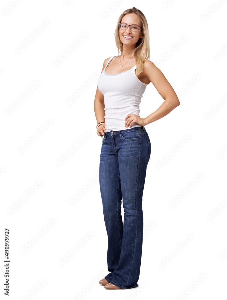 Glowing with confidence. Confident young woman in blue jeans standing with her hands on her hips. Glowing with confidence. Confident young woman in blue jeans standing with her hands on her hips.