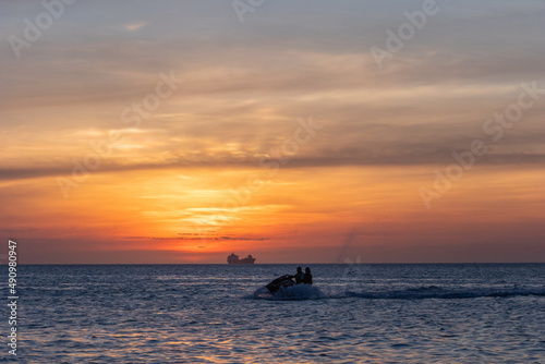 jet ski in a sunset at sea