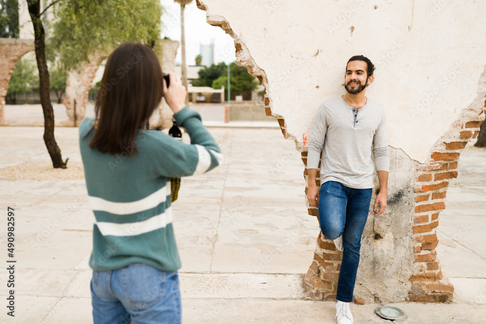 Couple using a camera outdoors Couple using a camera outdoors