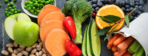 Foods high in lutein on dark background. photo