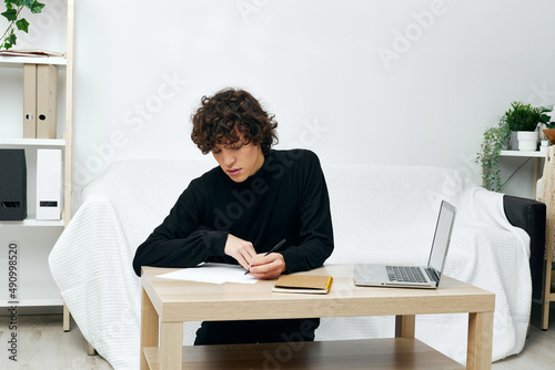 guy laptop sitting on white sofa online training communication © SHOTPRIME STUDIO