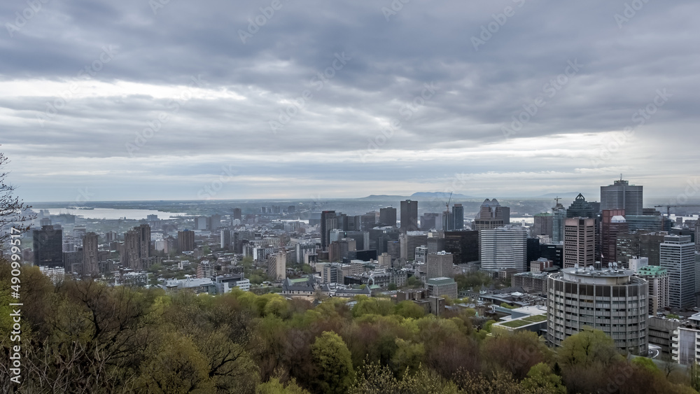 Panoramic view of the city center of Montreal from the Mount Royal (Mont Royal), a large intrusive rock hill or small mountain, west of Downtown Montreal in the province of Quebec, Canada