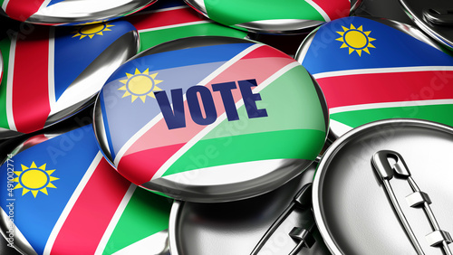 Vote in Namibia - national flag of Namibia on dozens of pinback buttons symbolizing upcoming Vote in this country. , 3d illustration