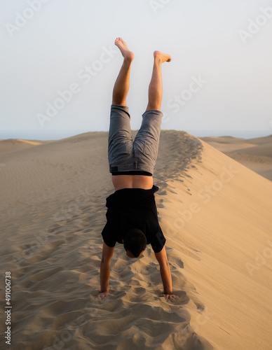 Boy exploring some sand dunes