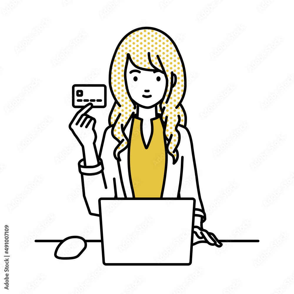 デスクで座ってPCを使いながらクレジットカードを手に持っているジャケットの女性 デスクで座ってPCを使いながらクレジットカードを手に持っているジャケットの女性