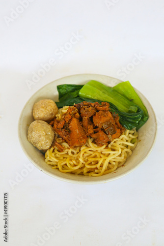 mie ayam or noodles chicken is traditional  food from indonesia, asia made from  noodle, chicken, chicken broth, spinach, sometimes with meatball.
 photo