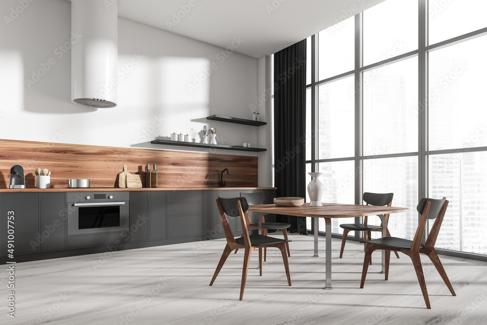 Fototapeta premium Corner view on bright kitchen room interior with dining table