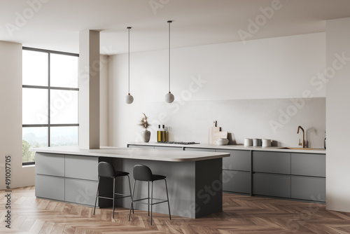 Light kitchen set interior with table and seats, shelves and kitchenware, window