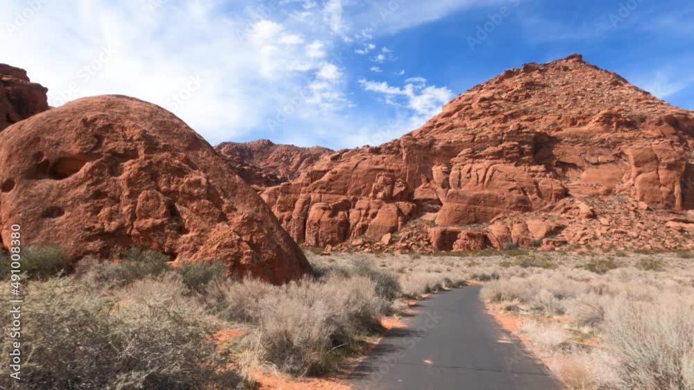 Riding bike trail desert red rock landscape St George . Bicycle trails in St George southern Utah desert and red rock landscape. Healthy Exercise on paths in mountains, valley and city. Electric bike. Riding bike trail desert red rock landscape St George . Bicycle trails in St George southern Utah desert and red rock landscape. Healthy Exercise on paths in mountains, valley and city. Electric bike.