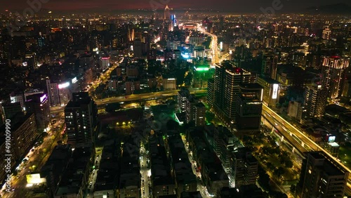 Wallpaper Mural Hyperlapse shot flight over lighting city of Taipei with traffic on highway and road at night - Downtown of Taipei Metropolis,capital of Taiwan. Beautiful illuminated cityscape with skyscrapers Torontodigital.ca