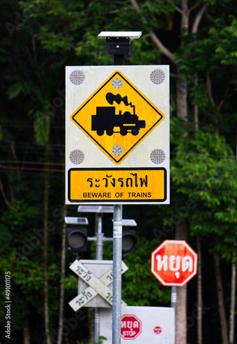 beware of trains sign. Use solar cells.