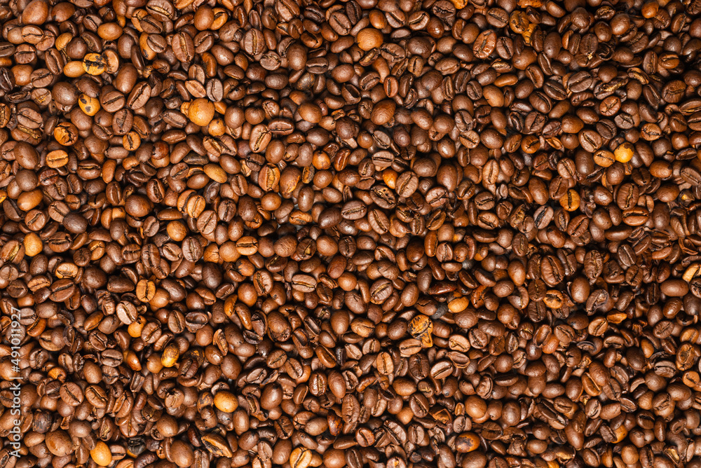 Coffee beans on a white background. Top view. Coffee beans on a white background. Top view.