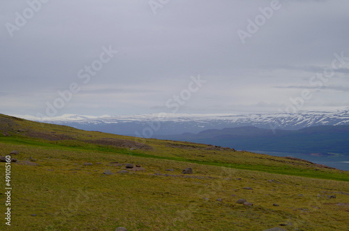 Breathtaking scenery of mountains, galciers and waterfalls in Seydisfjordur, Iceland during cruising to Polar Sea with beautiful scenic panorama nature landscape in Fjord photo