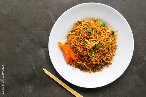 "yakisoba is traditional stir fried noodle japan, made from noodles, cabbage, vegetables and meat, seasoning with oyster sauce or yakisoba sauce.
yakisoba served on plate"
