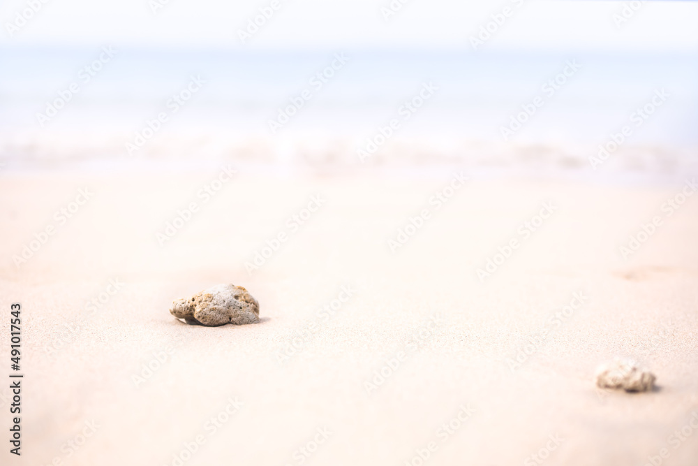 Soft focus Stone on sand beach at coast with blur blue sea and blue sky. nature outdoor landscape background. tourism vacation travel tropical summer season ocean in holidays concept. Soft focus Stone on sand beach at coast with blur blue sea and blue sky. nature outdoor landscape background. tourism vacation travel tropical summer season ocean in holidays concept.
