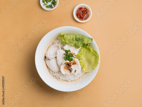 Canvas Print singapore food Sliced Fish Bee Hoon in a bowl with soup, chili sauce and spring