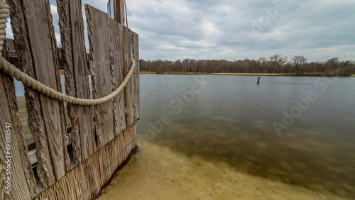 wall with rope leading into the silver lake, photo