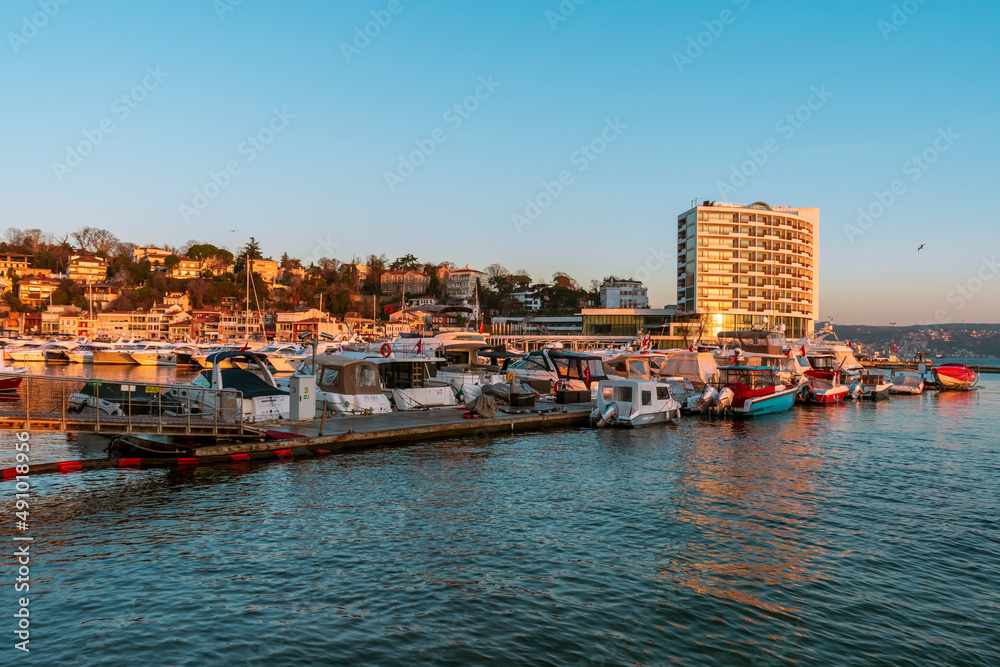 sunrise over Tarabya bay of Istanbul. REflection of boats and Tarabya hotel