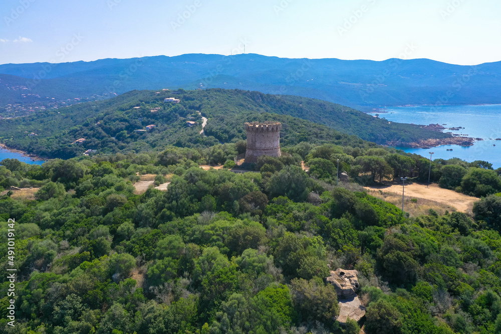 Panoramic aerial view of the Corsican coast with a Genoese watchtower near the capital Ajaccio. Corsica, France.