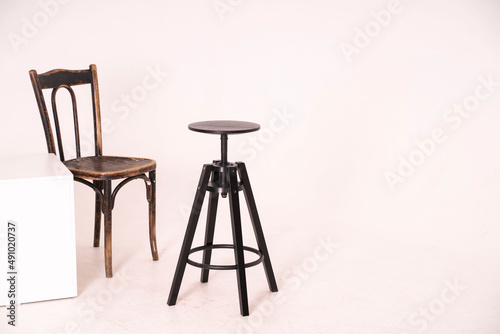 Bar black chairs and retro chair on a white background With copy space