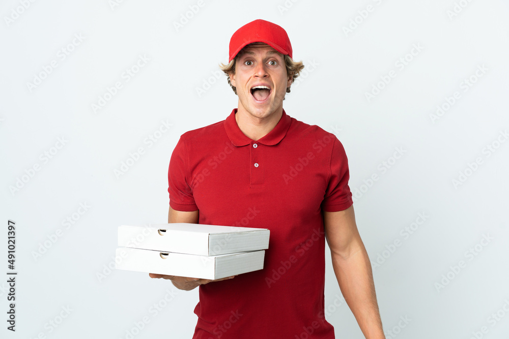 pizza delivery man over isolated white background with surprise facial expression pizza delivery man over isolated white background with surprise facial expression