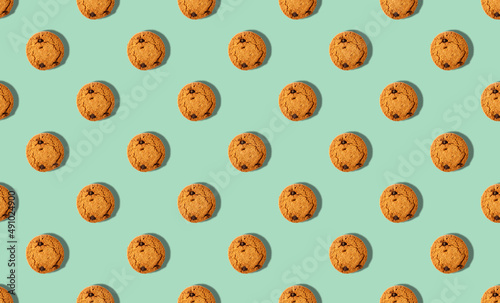 pattern of oatmeal cookies on a pink background