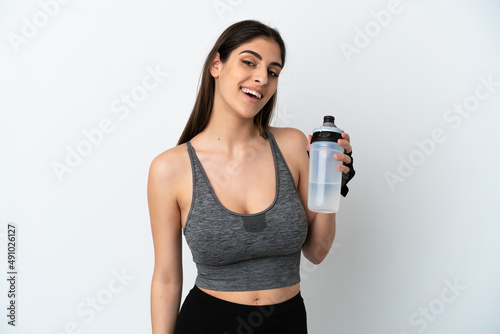 Young caucasian woman isolated on white background with sports water bottle