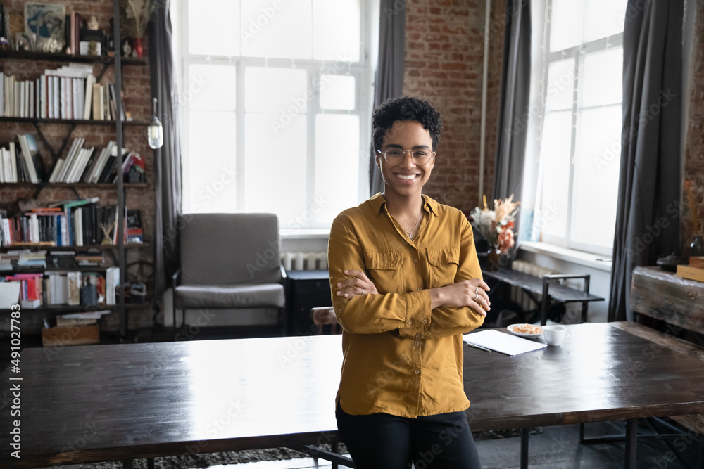 © fizkes - Happy confident young Black business woman, freelance professional, entrepreneur head shot portrait. Cheerful short haired female leader, employee posing in home office. Corporate head shot portrait © fizkes - Happy confident young Black business woman, freelance professional, entrepreneur head shot portrait. Cheerful short haired female leader, employee posing in home office. Corporate head shot portrait