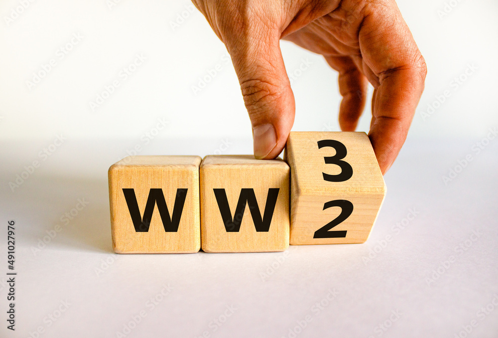 WW3 world war 3 symbol. Businessman turns the wooden cube and changes the  concept word WW2 to WW3. Beautiful white table white background, copy  space. Business WW3 world war 3 concept. Photos |