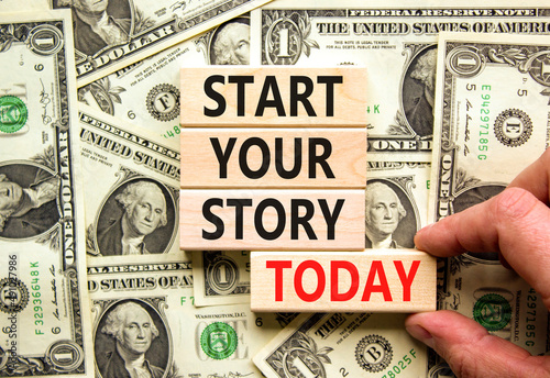 Start your story today symbol. Concept words Start your story today on wooden blocks. Businessman hand. Beautiful background from dollar bills. Start your story today business concept. Copy space.