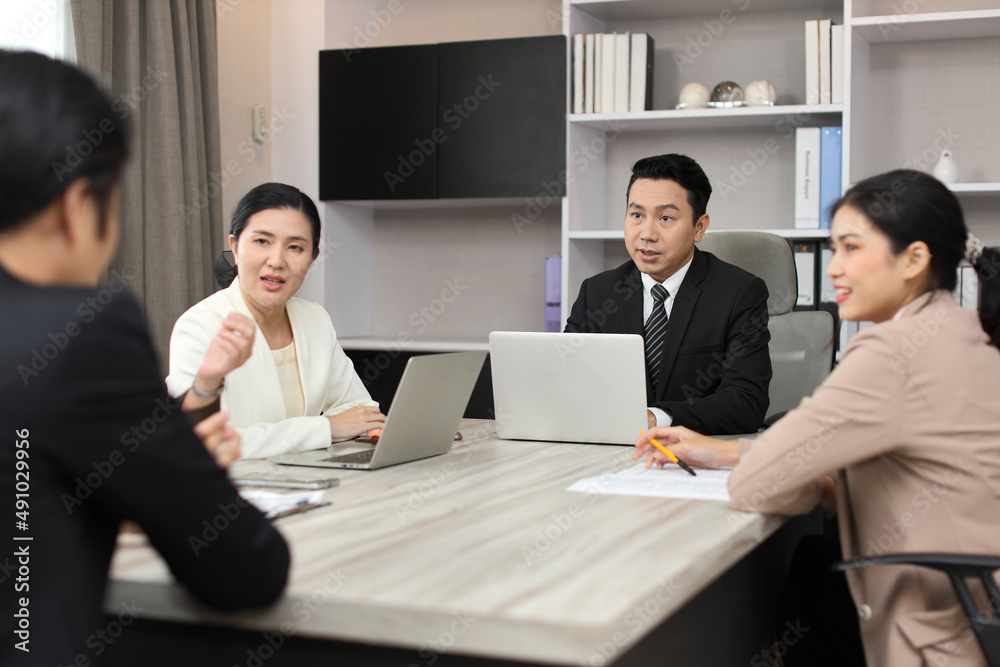 Collaborative process of professional businesspeople going over on new project together, using computer presentation and brainstorming ideas, coworker and working together at office meeting concept Collaborative process of professional businesspeople going over on new project together, using computer presentation and brainstorming ideas, coworker and working together at office meeting concept