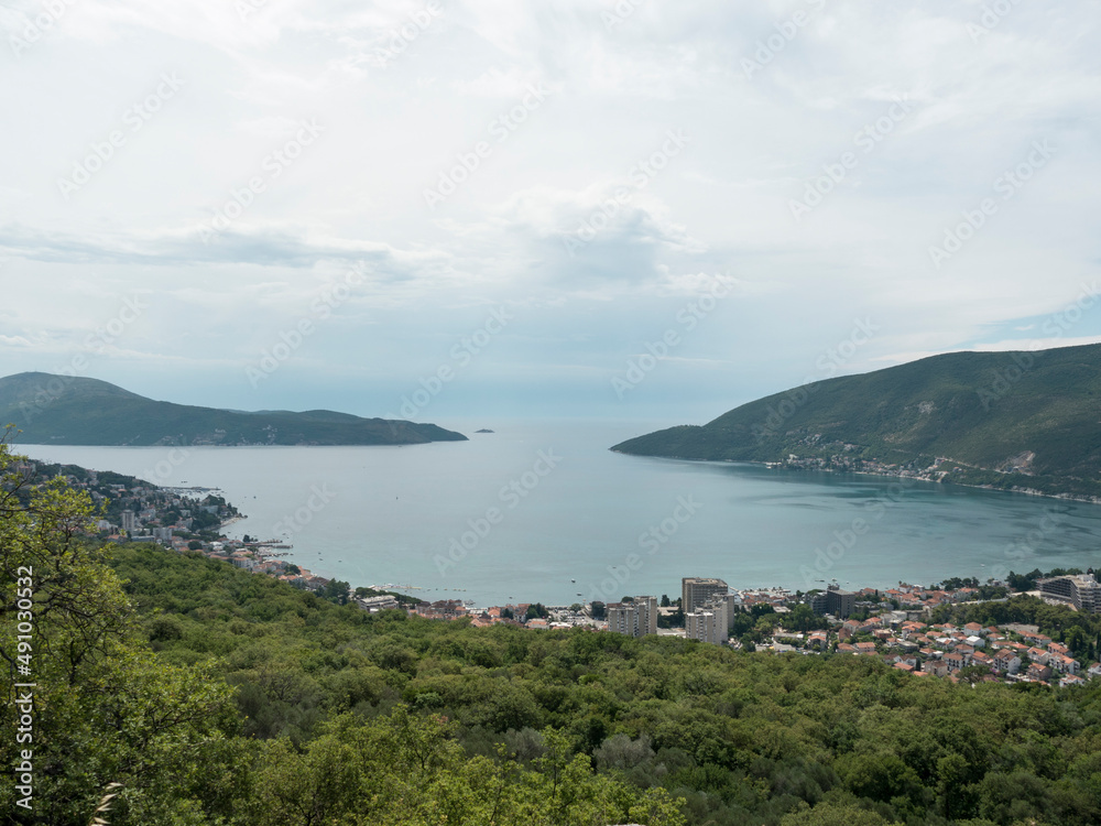 Sea harbor and town in mountains landscape view from top
