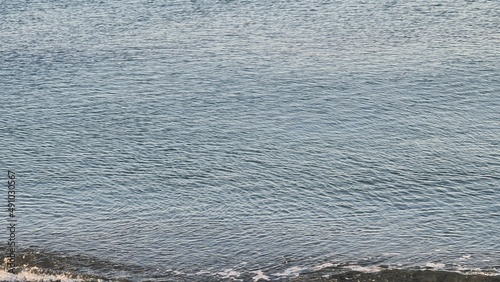 Wallpaper Mural Savona, Italy - February 12, 2022: Panorama of the sea sunset, light above the water, ocean sunrise. Some little waves in winter days. Torontodigital.ca