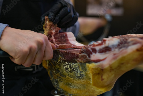 view of a producer cutting ham