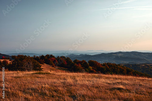 View of countryside hilly landscape in autumn colors.