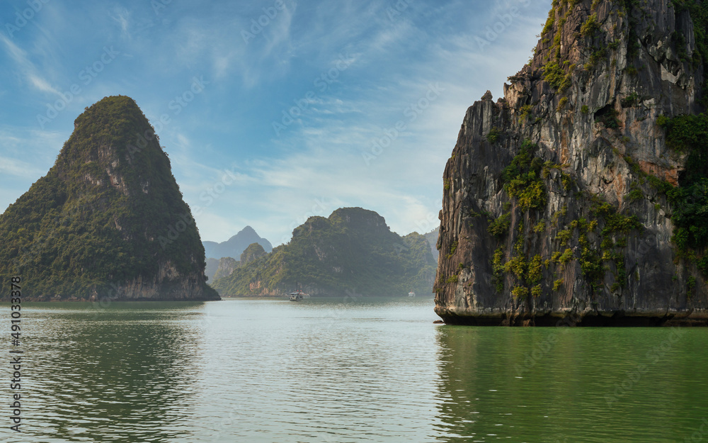 View of some of the 1,600 limestone island, that looks like something right out of a movie. UNESCO World Heritage Site since 1994 features a wide range of biodiversity. View of some of the 1,600 limestone island, that looks like something right out of a movie. UNESCO World Heritage Site since 1994 features a wide range of biodiversity.