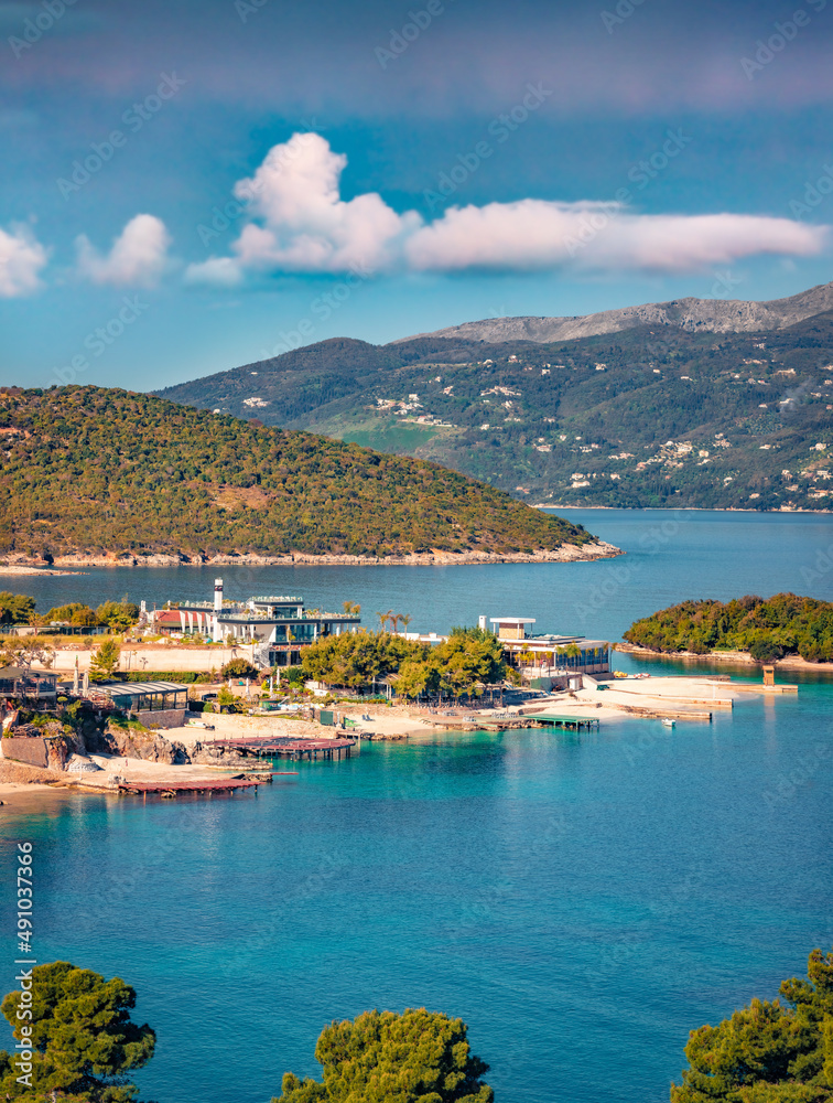Fototapeta premium Aerial seascape of Ionian sea with Corfu island on background. Adorable summer view of Ksamil village. Stunning outdoor scene of Albania, Europe. Traveling concept background.