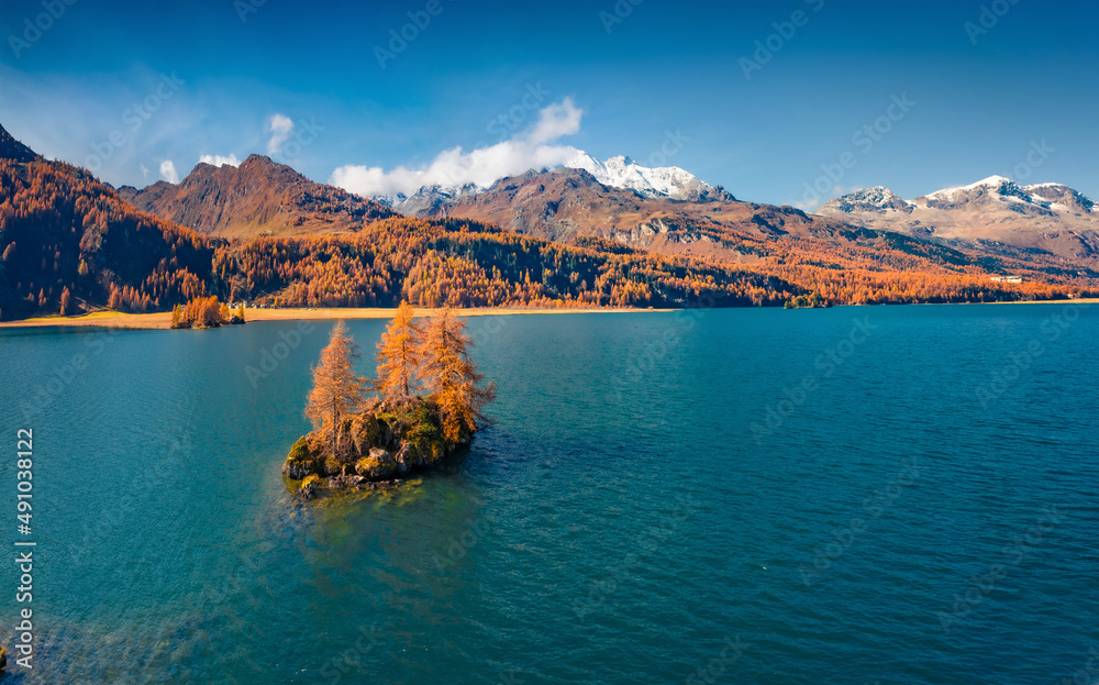 Incredible autumn view from flying drone of Sils Lake (Silsersee). Superb morning scene of Swiss Alps, Maloja Region, Upper Engadine, Switzerpand, Europe. Beauty of nature concept background..