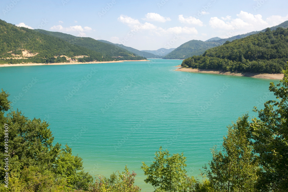 A large expanse of emerald-colored lake water