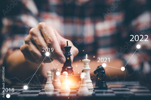 Planning and Decision concept, Businessman with strategy competitive ideas concept with chess board game. Business competition, Fighting and confronting problems, threats from surrounding problems.