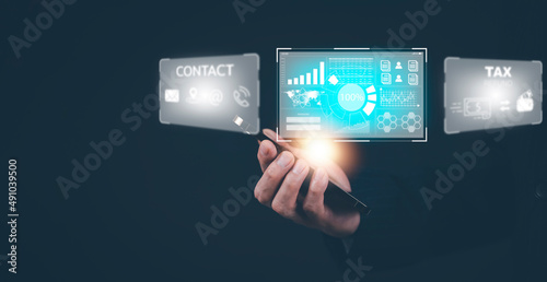 Businessman hand touch smartphone with a hologram on his smartphone, communication network, cyber security, online documentation database, and process automation to efficiently manage technology.