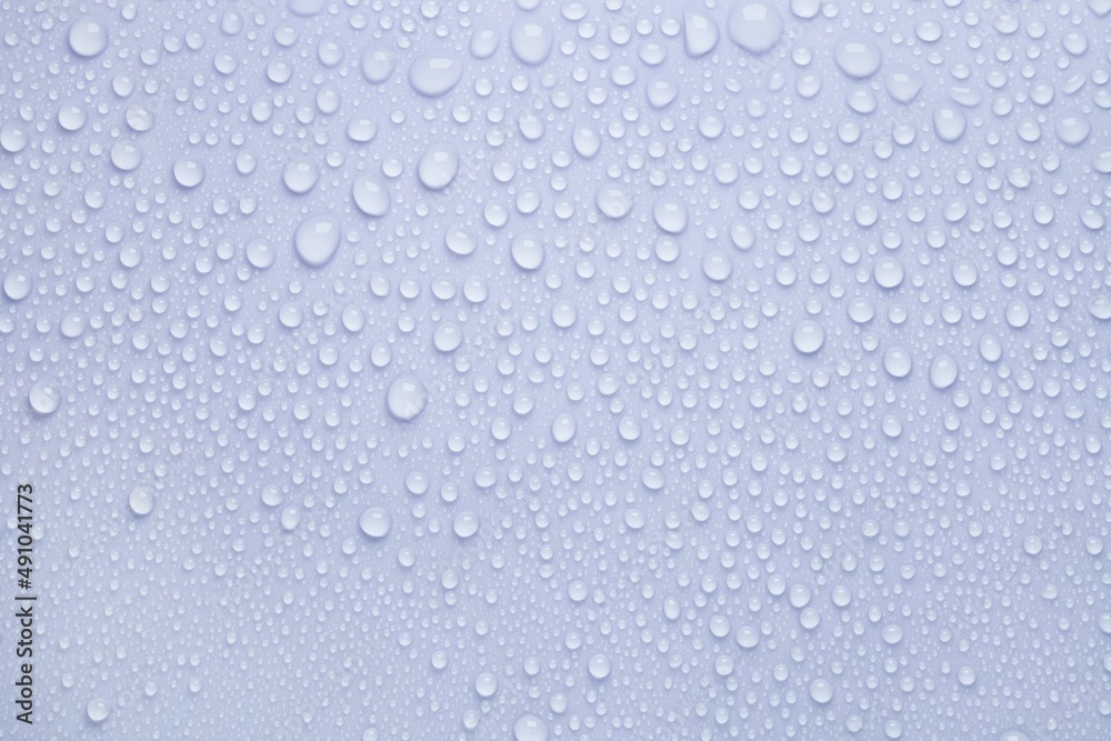 Cosmetic moisturizing liquid drops on gray background. Toner or lotion. Hyaluronic vitamine serum Cosmetic moisturizing liquid drops on gray background. Toner or lotion. Hyaluronic vitamine serum
