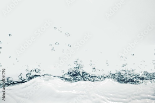Splash blue gray cosmetic moisturizer water, micellar toner, or emulsion abstract background. 