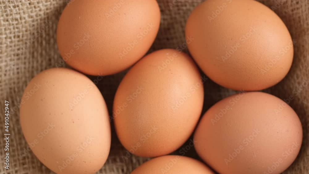 Chicken egg, rotation shot, Chicken fresh raw eggs.Healthy fresh food ingredients for breakfast. Animal products. Grocery. Chicken farm fresh eggs Chicken egg, rotation shot, Chicken fresh raw eggs.Healthy fresh food ingredients for breakfast. Animal products. Grocery. Chicken farm fresh eggs