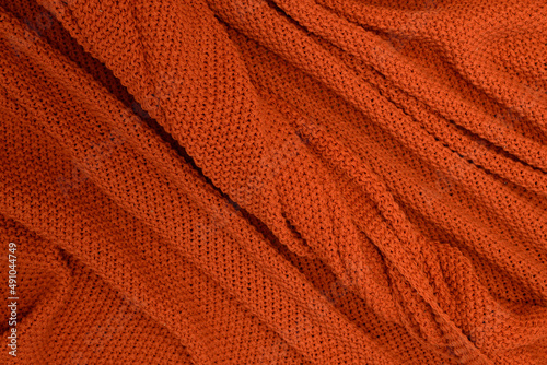  Rudy lub pomarańczowy materiał wełna jako tekstura lub tło na pulpit . Kompozycja dla tekstury.