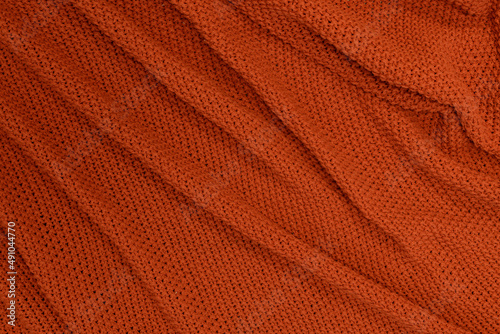 Rudy lub pomarańczowy materiał wełna jako tekstura lub tło na pulpit . Kompozycja dla tekstury.